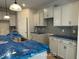 Kitchen with gray backsplash and granite countertops at 187 Regis Ln # 10, Coats, NC 27521
