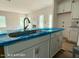 View of kitchen island with a stainless steel sink at 187 Regis Ln # 10, Coats, NC 27521