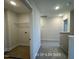 A practical laundry area featuring a wire rack shelf and connections for a washer and dryer at 187 Regis Ln # 10, Coats, NC 27521