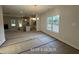 Open-concept living room featuring a kitchen and dining room at 187 Regis Ln # 10, Coats, NC 27521