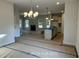 Open-concept living room with a fireplace at 187 Regis Ln # 10, Coats, NC 27521