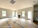Bright living room featuring a fireplace and an exit door at 187 Regis Ln # 10, Coats, NC 27521