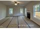 A new living room is well-lit and features a ceiling fan and fireplace at 187 Regis Ln # 10, Coats, NC 27521