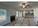 The living room and kitchen are open concept and well-lit with many windows at 187 Regis Ln # 10, Coats, NC 27521