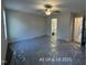 A primary bedroom includes ceiling fan and an ensuite bathroom at 187 Regis Ln # 10, Coats, NC 27521