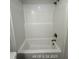 A pristine white shower-tub combo is tiled with white subway tile at 187 Regis Ln # 10, Coats, NC 27521