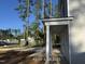 Side view of a charming home featuring white support columns and neatly installed vinyl siding at 187 Regis Ln # 10, Coats, NC 27521