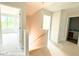 An unfinished stairway with a light wood railing and an upper hallway with doorways and a bathroom sink at 187 Regis Ln # 10, Coats, NC 27521