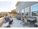 Back deck featuring an outdoor dining set, seating and a shaded pergola with swing at 1950 Firenza Dr, Apex, NC 27502