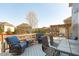 Back deck featuring an outdoor dining set, seating and a shaded pergola with swing at 1950 Firenza Dr, Apex, NC 27502