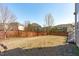 Large backyard with a wood fence and view of other houses at 1950 Firenza Dr, Apex, NC 27502
