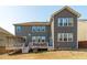 Backyard featuring a patio with a pergola and a view of the home's rear elevation at 1950 Firenza Dr, Apex, NC 27502