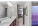 Bathroom featuring double sinks and a view into another room with a shower at 1950 Firenza Dr, Apex, NC 27502