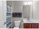 Bright bathroom featuring a shower with blue striped curtain, toilet, and vanity with framed mirror at 1950 Firenza Dr, Apex, NC 27502
