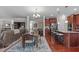 Open-concept layout with dining area, kitchen with granite countertops, and cozy living space at 1950 Firenza Dr, Apex, NC 27502