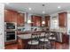 Kitchen features updated stainless appliances and a center island with seating at 1950 Firenza Dr, Apex, NC 27502