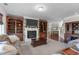 Comfortable living room showcasing fireplace, built-in shelving, and neutral tones at 1950 Firenza Dr, Apex, NC 27502