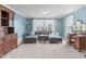 Comfortable living room featuring a large sectional sofa, area rug, and decorative furniture at 1950 Firenza Dr, Apex, NC 27502