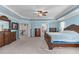 Spacious main bedroom with tray ceilings, neutral walls, carpet flooring, and classic furnishing at 1950 Firenza Dr, Apex, NC 27502