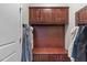 Mudroom with built-in storage, including cabinets and bench, for organization at 1950 Firenza Dr, Apex, NC 27502
