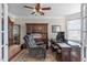Inviting office space with built-in shelving, hardwood floors, and a comfortable chair at 1950 Firenza Dr, Apex, NC 27502