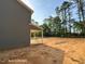 Spacious backyard featuring an open patio and ample room for outdoor activities and landscaping opportunities at 205 Regis Ln # 11, Coats, NC 27521