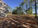 A spacious backyard area that features mature trees at 205 Regis Ln # 11, Coats, NC 27521