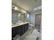 Bathroom with double sink vanity, large mirror, and walk-in shower at 205 Regis Ln # 11, Coats, NC 27521