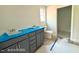 Bathroom featuring a window and a single sink vanity, awaiting personalization at 205 Regis Ln # 11, Coats, NC 27521