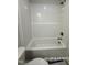 Bathroom featuring a new white tub and shower combination with tiled walls at 205 Regis Ln # 11, Coats, NC 27521
