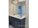 Bathroom with double sink vanity and large mirror at 205 Regis Ln # 11, Coats, NC 27521
