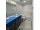 Bathroom showcases a vanity with dark cabinetry and white countertop, complemented by a tiled shower-tub combination at 205 Regis Ln # 11, Coats, NC 27521