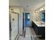 Bathroom with double sink vanity and walk-in shower at 205 Regis Ln # 11, Coats, NC 27521