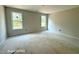 Bright bedroom featuring two windows and awaiting personalization to become a cozy retreat at 205 Regis Ln # 11, Coats, NC 27521