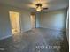 Spacious bedroom with a ceiling fan and carpet flooring at 205 Regis Ln # 11, Coats, NC 27521