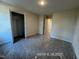 Bright bedroom features neutral walls and carpeted floors and a closet at 205 Regis Ln # 11, Coats, NC 27521