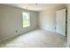 Bright bedroom featuring a window and awaiting personalization to become a cozy retreat at 205 Regis Ln # 11, Coats, NC 27521