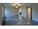 Spacious bedroom with a ceiling fan, ensuite bath, and carpet flooring at 205 Regis Ln # 11, Coats, NC 27521