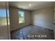 Bedroom featuring new carpet and exterior views from the window at 205 Regis Ln # 11, Coats, NC 27521