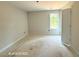 Bright bedroom featuring a window and awaiting personalization to become a cozy retreat at 205 Regis Ln # 11, Coats, NC 27521