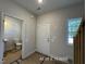 The entryway includes a powder room, interior door, and an exterior door with a view of stairs and the outside at 205 Regis Ln # 11, Coats, NC 27521