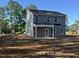 Gray two story home under construction features a covered porch at 205 Regis Ln # 11, Coats, NC 27521