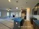 Open Kitchen with view of fireplace and lots of natural light at 205 Regis Ln # 11, Coats, NC 27521