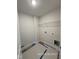 Neat laundry room features a shelf and connections for a washing machine and dryer at 205 Regis Ln # 11, Coats, NC 27521