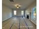 Bright living room featuring a cozy fireplace and many windows at 205 Regis Ln # 11, Coats, NC 27521