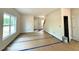 Bright and airy living room featuring freshly painted walls, neutral flooring, and ample natural light at 205 Regis Ln # 11, Coats, NC 27521