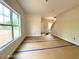View of the living room with large windows that bring in natural light with a staircase at 205 Regis Ln # 11, Coats, NC 27521