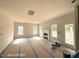 Bright, airy living room featuring a fireplace and multiple windows for abundant natural light at 205 Regis Ln # 11, Coats, NC 27521