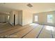Bright, open-concept living area with natural light, freshly painted walls, and neutral flooring, move-in ready at 205 Regis Ln # 11, Coats, NC 27521
