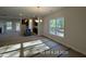 Spacious living area with large windows, recessed lighting, an island, and ample natural light streaming through windows at 205 Regis Ln # 11, Coats, NC 27521